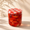 Vela artesanal Mermelada de Mandarina de Casa Calma en tarro de cristal con tapa de cuadros rojos, vista frontal