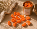 Detalle de wax melts de cera vegetal con aroma a mandarina y champán, elaborados a mano en España